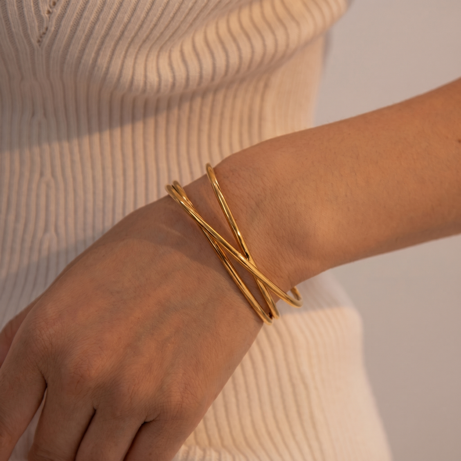 Gold bangles worn on wrist